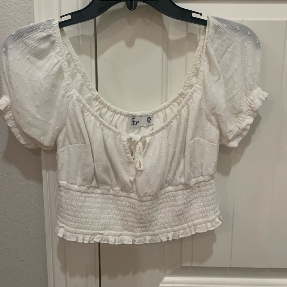 Hollister crop top with subtle print and tie in the middle.